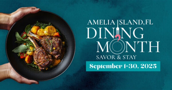 A person holds a black bowl filled with cooked lamb chops, potatoes, and greens. Text reads: “Amelia Island, FL Dining Month Savor & Stay, September 1-30, 2025” on a teal background.