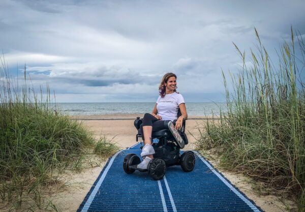 woman in wheelchair on beach