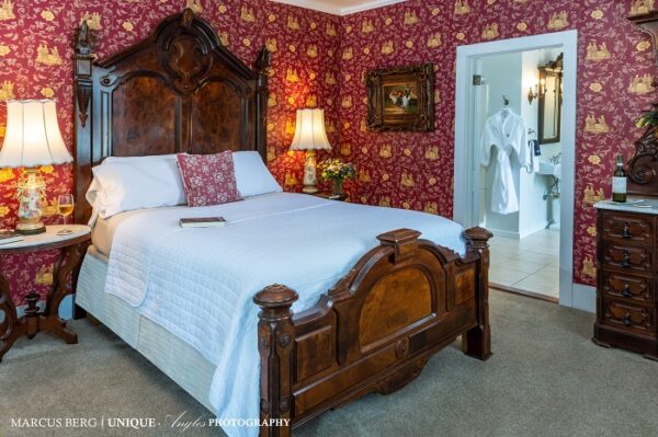Amelia Island Williams House bedroom with red wallpaper
