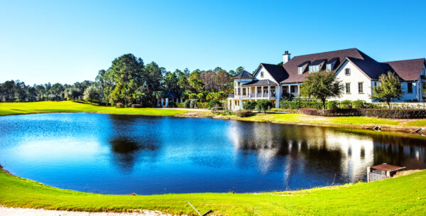 Amelia National Golf water and house