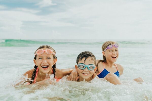 children enjoying ocean