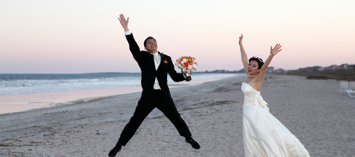 wedding photos on beach jumping