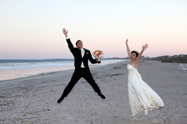 wedding photos on beach jumping