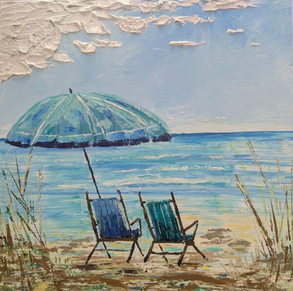 Painting of two empty beach chairs under a large blue umbrella facing a calm sea, with wispy clouds and some tall grass at the edge of the sandy shore. The scene is peaceful and inviting.