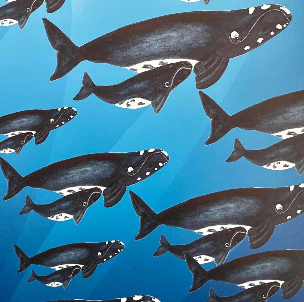A pattern of multiple right whales and their calves swimming on a blue background.