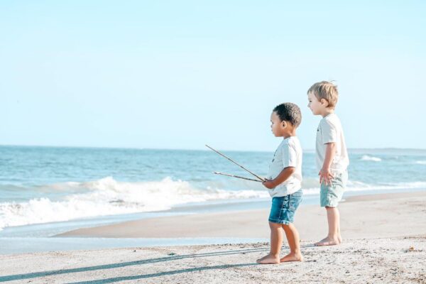 young boys walking on beach