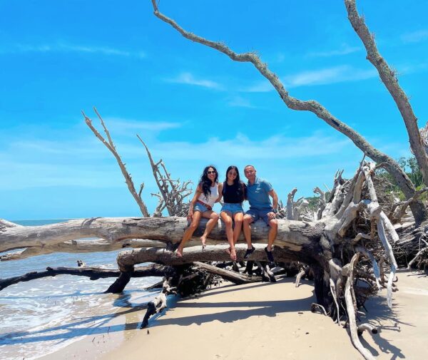 posing on top of driftwood