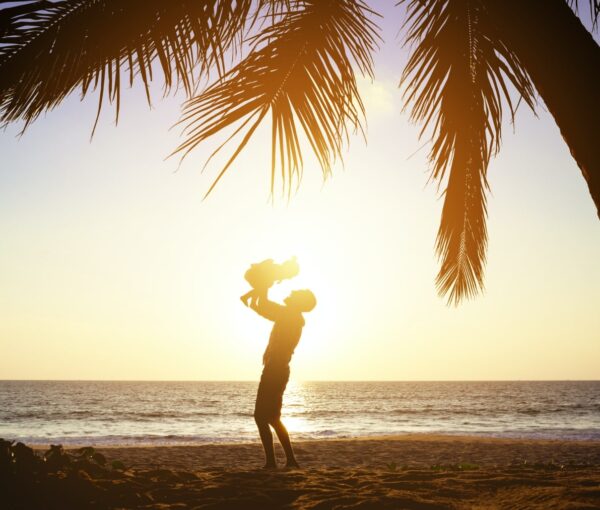 father and daughter on beach