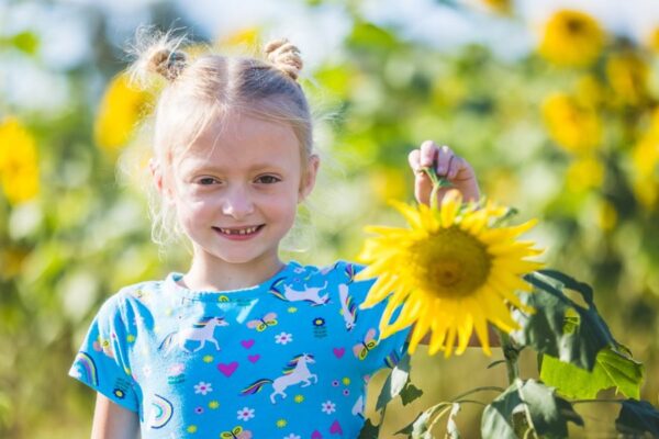 girl in sunflower field at Conner's A-Maize-ing Acres
