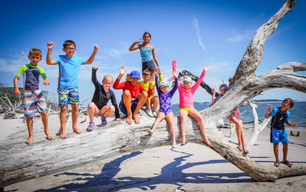 family posing on wood