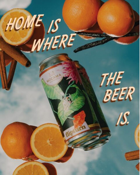 Two beer cans with tropical labels surrounded by oranges, cinnamon sticks, and vanilla beans against a sky background. Text reads: Home is where the beer is..