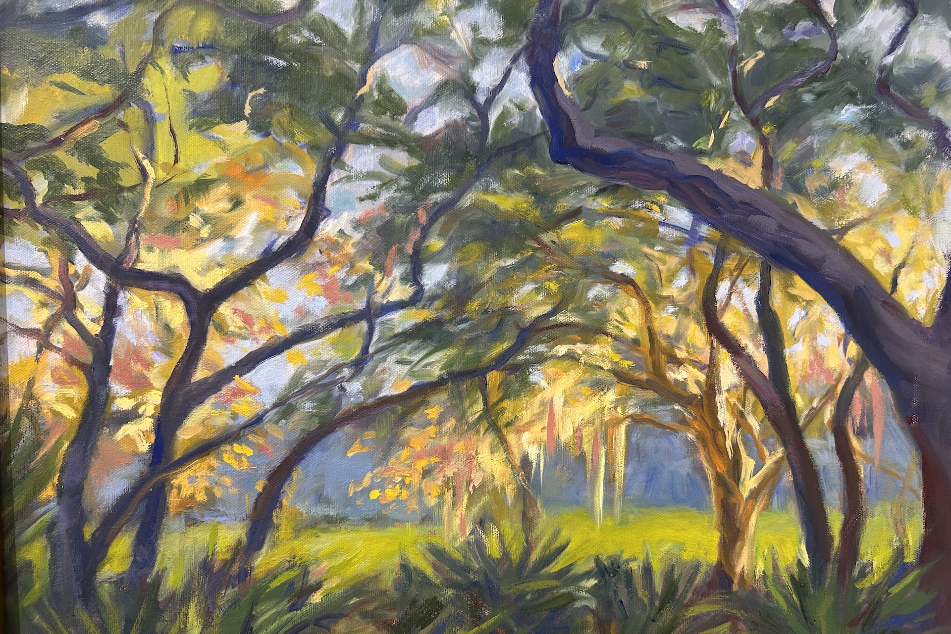 Colorful painting of a sunlit forest, with twisting tree branches, green foliage, and dappled light creating a vibrant, serene atmosphere.