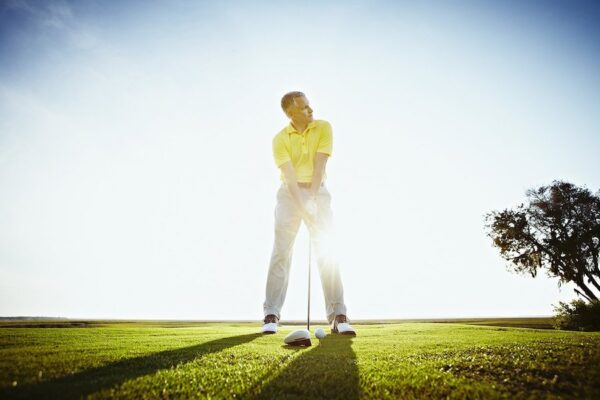 man swinging a golf club
