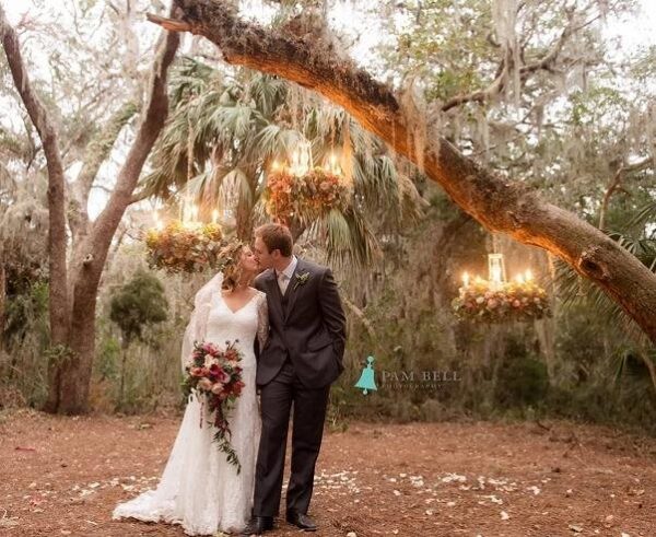 Amelia Island Weddings couple kissing in forest