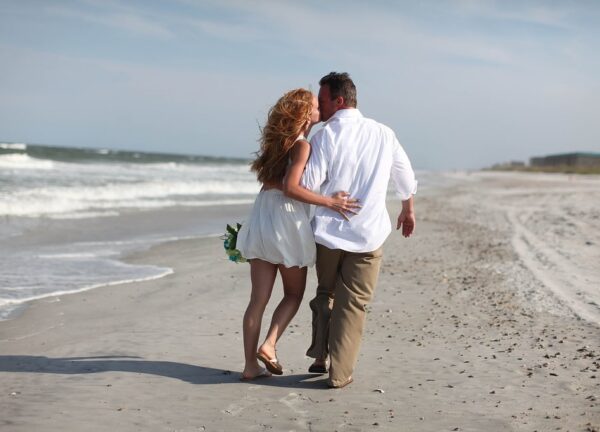 Amelia Island Weddings couple kissing on beach