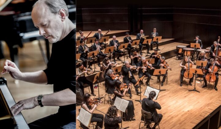 A man plays a grand piano on the left, while an orchestra with string and wind instruments performs on stage on the right. The musicians are seated in a concert hall with wooden floors.
