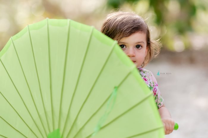 Pam Bell Photography young girl behind umbrella