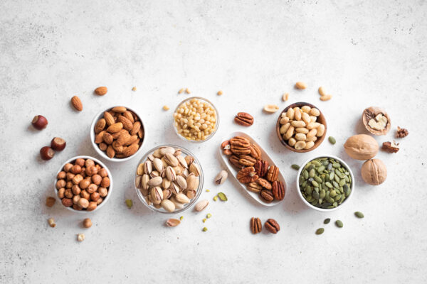 Nuts assortment - pecans, hazelnuts, walnuts, pistachios, almonds, pine nuts, peanuts, pumpkin seeds