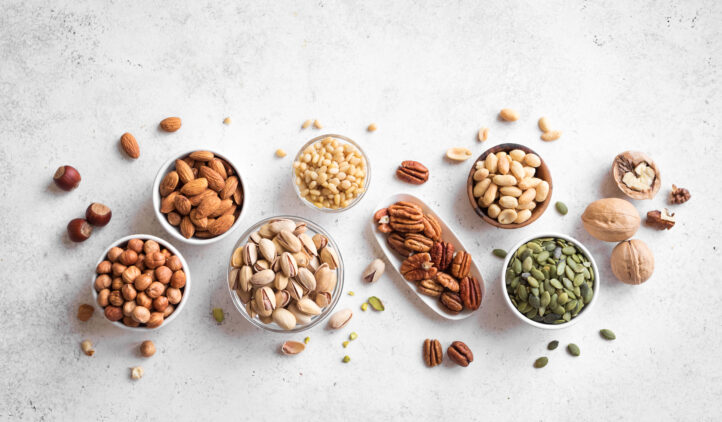 Nuts assortment - pecans, hazelnuts, walnuts, pistachios, almonds, pine nuts, peanuts, pumpkin seeds