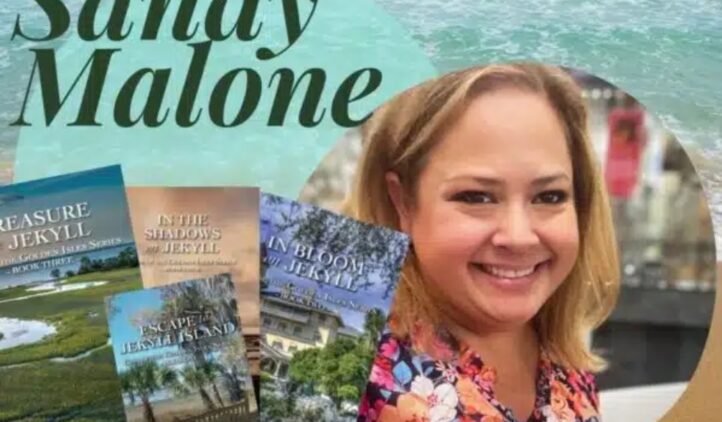 A smiling woman stands in front of a beach background. Next to her are four books with coastal themes. Large text reads “Sandy Malone.”.