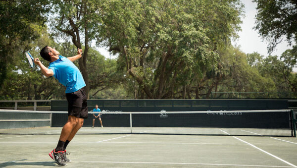 tennis pro serving