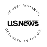 Circular text reads #8 Best Romantic Getaways in the U.S. surrounding the bold black U.S. News & World Report logo on a light gray background.