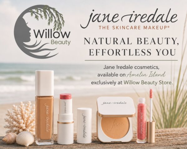 Jane Iredale makeup products are displayed on a beach with promotional text for Willow Beauty Store, highlighting their availability on Amelia Island.