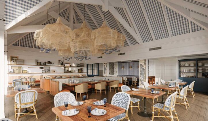 Interior of Surfcaster restaurant on Amelia Island with wooden tables, wicker chairs, blue and white patterned upholstery, and large woven pendant lights hanging from a high checkered ceiling. Part of the Port 'Dina Prime Rib or Thanksgiving Turkey event.
