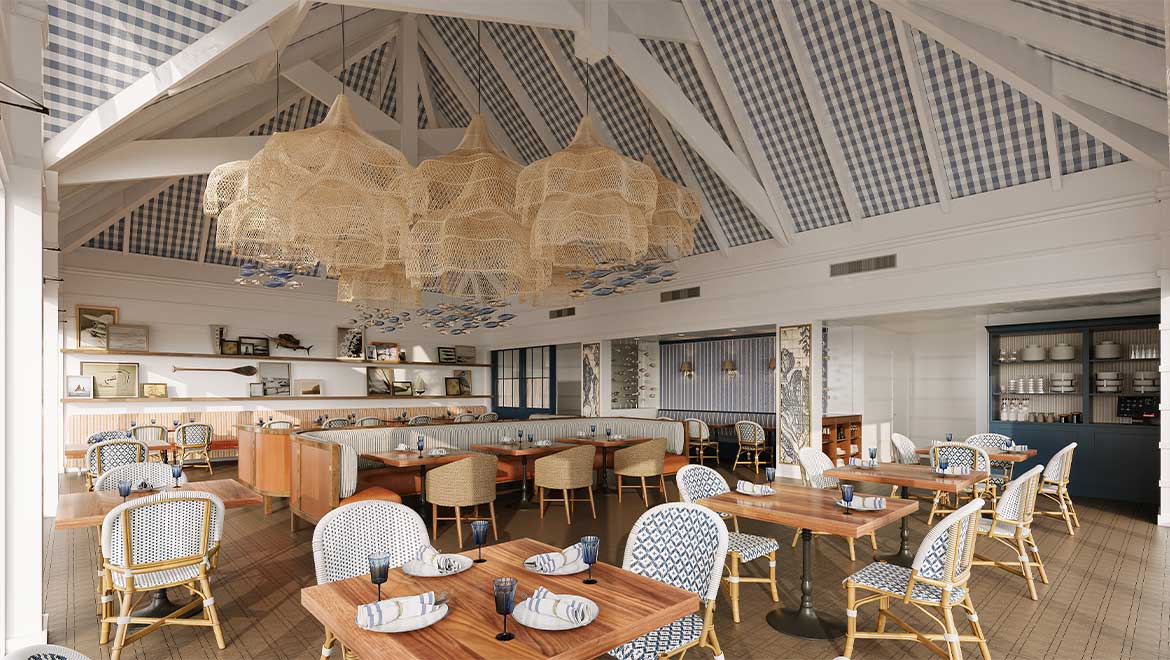 Interior of Surfcaster restaurant on Amelia Island with wooden tables, wicker chairs, blue and white patterned upholstery, and large woven pendant lights hanging from a high checkered ceiling. Part of the Port 'Dina Prime Rib or Thanksgiving Turkey event.