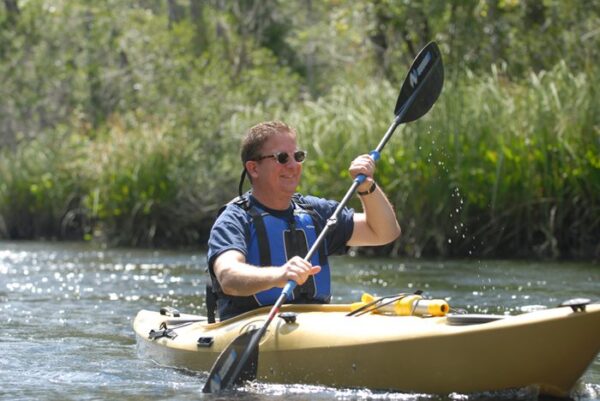 man kayaking outdoors