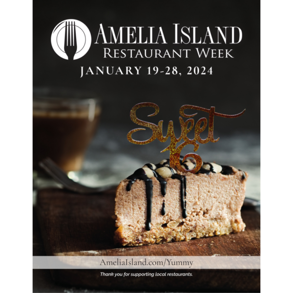 A slice of cheesecake with chocolate drizzle and nuts sits on a wooden board, with a Sweet 16 topper. Behind it is a blurred drink. Text above promotes Amelia Island Restaurant Week, January 19-28, 2024.